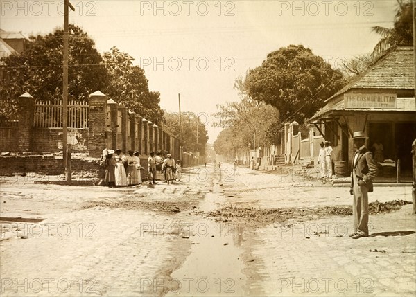 Street scene, Kingston. Street scene showing a sign that reads: 'Cars will not stop between North St. and Drummond St. on the up trip. By order': possibly an instruction to accommodate the city's trams. Kingston, Jamaica, circa 1895. Kingston, Kingston, Jamaica, Caribbean, North America .