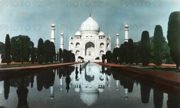 The Taj Mahal, circa 1925. View of the Taj Mahal, reflected in the central canal running up to its main entrance. Agra, United Provinces (Uttar Pradesh), India, circa 1925. Agra, Uttar Pradesh, India, Southern Asia, Asia.
