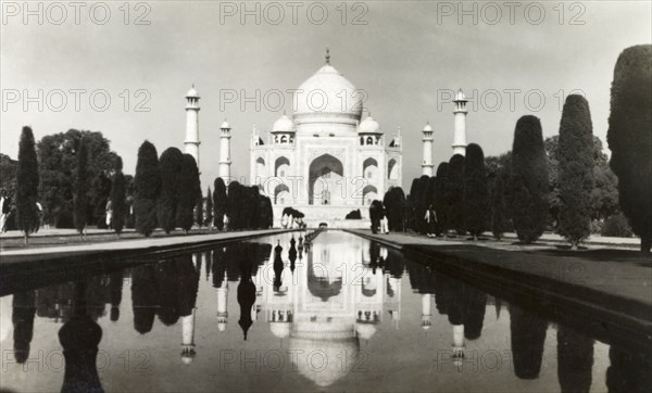 The Taj Mahal, circa 1925. View of the Taj Mahal, reflected in the central canal running up to its main entrance. Agra, United Provinces (Uttar Pradesh), India, circa 1925. Agra, Uttar Pradesh, India, Southern Asia, Asia.