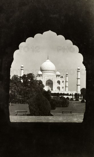 The Taj Mahal, circa 1925. View of the Taj Mahal, framed by an ornately-shaped doorway. Agra, United Provinces (Uttar Pradesh), India, circa 1925. Agra, Uttar Pradesh, India, Southern Asia, Asia.