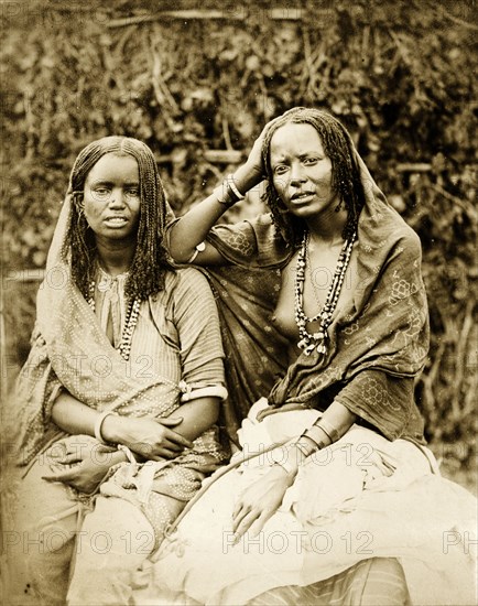 Women with braided hair. Portrait of two young women with braided hair, said to be Sudanese. Possibly Egypt, circa 1885. Egypt, Northern Africa, Africa.