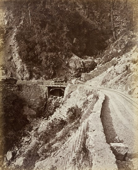 Darjeeling Hill Railway. A small bridge carries a section of the Darjeeling Hill Railway across a narrow ravine in the mountains. Darjeeling, India, circa 1885. Darjeeling, West Bengal, India, Southern Asia, Asia.