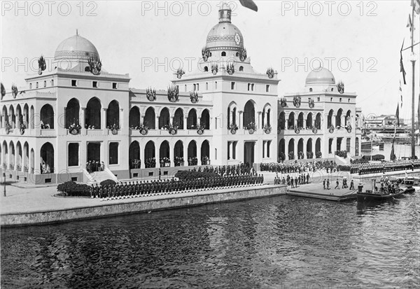 Inspecting the Guard of Honour. King George V and Abbas Hilmi, the Khedive of Egypt, return to the royal yacht HMS Medina after an inspection of the Guard of Honour. The ship was transporting King George V and Queen Mary to India for the Coronation Durbar at Delhi. Port Said, Egypt, circa 21 November 1911. Port Said, Port Said, Egypt, Northern Africa, Africa.