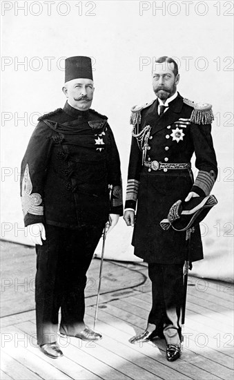 Khedive of Egypt and King George V. Abbas Hilmi, Khedive of Egypt, and King George V (r.1910-36), pictured aboard HMS Medina on their way to India for the Coronation Durbar at Delhi. Port Said, Egypt, 21 November 1911. Port Said, Port Said, Egypt, Northern Africa, Africa.