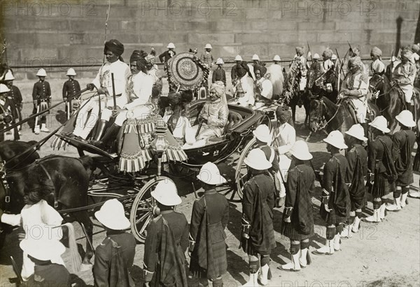 Procession of state entry. The Maharajah of Idar rides inside a horse-drawn carriage in the procession of state entry held for King George V's Coronation Durbar. Delhi, India, 7 December 1911. Delhi, Delhi, India, Southern Asia, Asia.