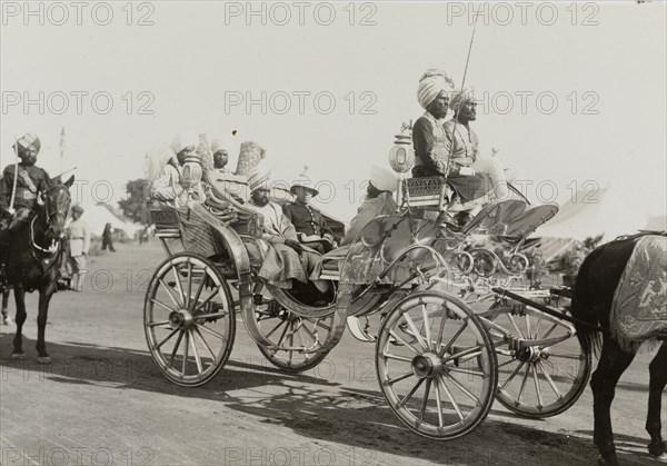 The Maharajah of Jind. Ranbir Singh (1879-1948), the Maharajah of Jind, arrives at the Coronation Durbar camp in an elaborate open carriage. He was one of many Indian princes who travelled to Delhi to pay homage to King George V, Emperor of India. Delhi, India, 9 December 1911. Delhi, Delhi, India, Southern Asia, Asia.