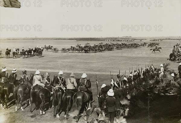 The Royal Horse Artillery. A section of the Royal Horse Artillery gallops past spectators during a display at King George V's Coronation Durbar. Delhi, India, 13 December 1911. Delhi, Delhi, India, Southern Asia, Asia.