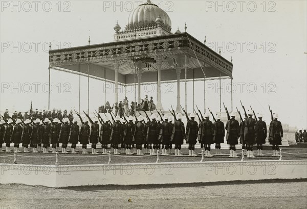 The Coronation Durbar, 1911. King George V (r.1910-36) and Queen Mary sit enthroned beneath the royal canopy in the Coronation Durbar arena. Delhi, India, 12 December 1911. Delhi, Delhi, India, Southern Asia, Asia.