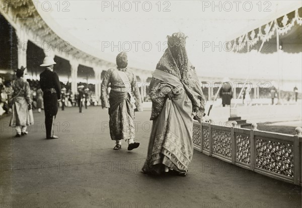 Nawab Sultan Jahan Begum. Nawab Sultan Jahan Begum (1858-1930), the Muslim ruler of Bhopal, leaves the arena after paying homage to King George V and Queen Mary at the Coronation Durbar. She is shrouded in a heavy, embroidered gown and wears a veil that covers her face, topped by an elaborate crown. Delhi, India, 12 December 1911. Delhi, Delhi, India, Southern Asia, Asia.