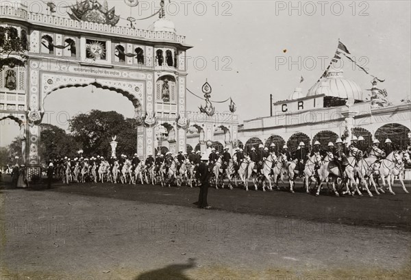Hussar escort at Calcutta. A uniformed regiment of Hussars provide a mounted escort for King George V and Queen Mary on their arrival to Calcutta (Kolkata) following the Coronation Durbar at Delhi. Calcutta (Kolkata), India, circa 1 January 1912. Kolkata, West Bengal, India, Southern Asia, Asia.