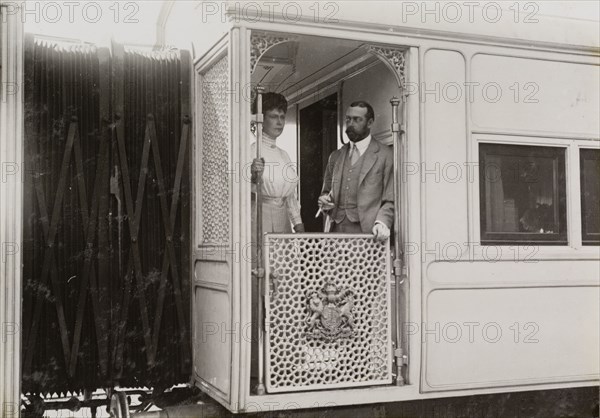 King George V and Queen Mary. King George V (r.1910-36) and Queen Mary on board the royal train. The couple had travelled from England for the Coronation Durbar at Delhi. After a brief visit to Nepal, they then embarked on a tour of India, which included an official visit to Kolkata, returning by royal train to Mumbai. India, circa 4 January 1912. India, Southern Asia, Asia.
