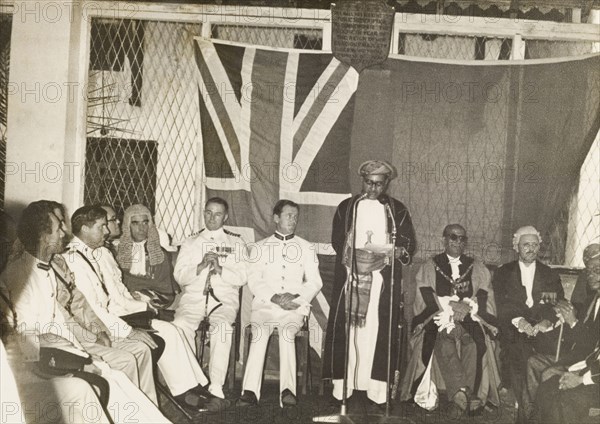 The Liwali of Mombasa's speech. The Liwali (Muslim government representative) of Mombasa, Sheikh Al'Amin bin Said El-Mandhry, delivers a speech to British and Kenyan government officials at a 'baraza' (assembly) held to mark the Islamic pilgrimage of Hajj. Mombasa, Kenya, 15 May 1962. Mombasa, Coast, Kenya, Eastern Africa, Africa.