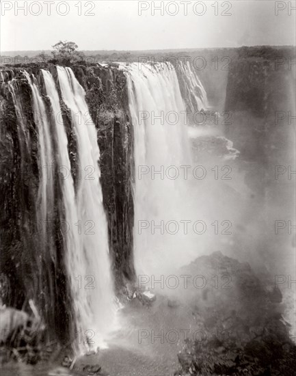 Victoria Falls. View of Victoria Falls, situated on the Zambezi River on the border between modern-day Zambia and Zimbabwe. Matabeleland, Southern Rhodesia (Matabeleland North, Zimbabwe), 12 November 1910. Victoria Falls, Matabeleland North, Zimbabwe, Southern Africa, Africa.