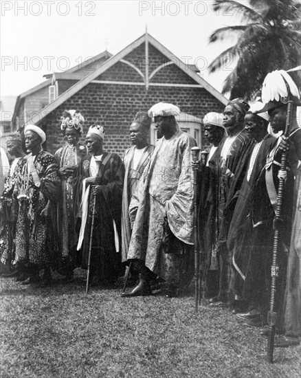 Bechuanaland chiefs await the Duke of Connaught. A number of finely dressed Bechuanaland chiefs assemble to receive the Duke of Connaught at an outdoor reception. This was one of several stops made by the Duke following his official visit to Cape Town to open the new Union Parliament. Gaberones, Bechuanaland (Gaborone, Botswana), 24 November 1910. Gaborone, South East (Botswana), Botswana, Southern Africa, Africa.