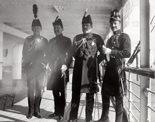 British officers aboard the S.S. Balmoral Castle. Four high-ranking British officers in full military regalia pose for the camera aboard the S.S. Balmoral Castle. Durban, Natal (KwaZulu Natal), South Africa, circa 2 December 1910. Durban, KwaZulu Natal, South Africa, Southern Africa, Africa.