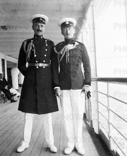 Officers aboard the S.S. Balmoral Castle. Two high-ranking British officers pose for the camera aboard the S.S. Balmoral Castle. The ship was transporting the Duke and Duchess of Connaught to England from South Africa, where they had recently opened the new Union Parliament in Cape Town. Probably Indian Ocean, Africa, circa 2 December 1910. Africa.