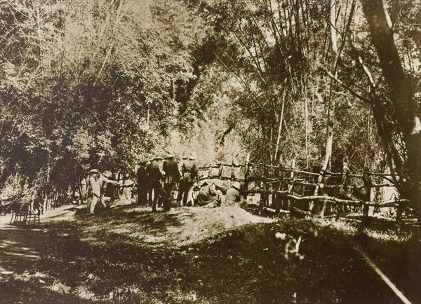 Progress of the drive. The Maharajah of Mysore (Krishna Raja Wadiyar IV, 1884-1940) and his hunting party watch the progress of an elephant drive from behind a stockade in the Kakankota Forests. Karnataka, India, 1909., Karnataka, India, Southern Asia, Asia.