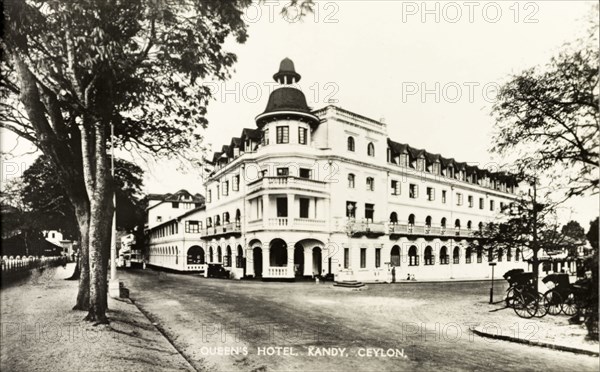 The Queen's Hotel, Kandy. The Queen's Hotel, located on a street corner in the centre of town. Kandy, Ceylon (Sri Lanka), circa 1920. Kandy, Central (Sri Lanka), Sri Lanka, Southern Asia, Asia.