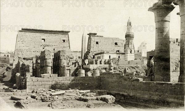 The mosque of Abou El Hagag. The mosque of Abou El Hagag, hidden within the ancient ruins of Luxor Temple, reveals itself with an ornate minaret. Luxor, Egypt, circa 1925. Luxor, Qina, Egypt, Northern Africa, Africa.