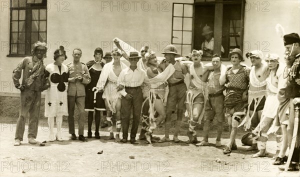 Soldiers in fancy dress. A group of British soldiers pose, wearing a variety of fancy dress costumes for a show they are about to perform. British Mandate of Mesopotamia (Iraq), circa 1925. Iraq, Middle East, Asia.