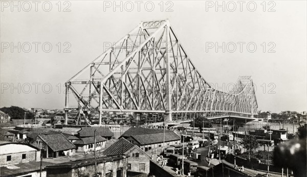 The Howrah Bridge. View of the Howrah Bridge, spanning the Hooghly River between the cities of Howrah and Kolkata. Calcutta (Kolkata), India, circa 1945. Kolkata, West Bengal, India, Southern Asia, Asia.