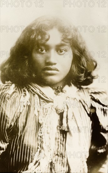 Young Maori woman. Studio portrait of a young Maori woman wearing typically Western dress including a satin blouse and neck scarf. New Zealand, circa 1903. New Zealand, New Zealand, Oceania.