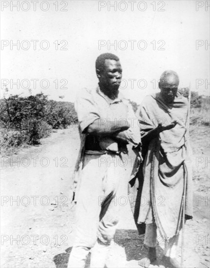 Agricultural slaves, Ethiopia. Portrait of two male slaves, employed to labour in the fields near Addis Ababa. Near Addis Ababa, Ethiopia, circa 1930. Addis Ababa, Addis Ababa, Ethiopia, Eastern Africa, Africa.