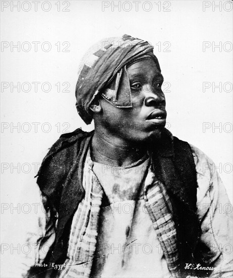 Portrait of a Nubian man. Semi-profile portrait of a Nubian man, dressed in unkempt clothing and a turban. Sudan, circa 1885. Sudan, Eastern Africa, Africa.