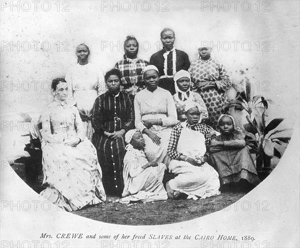 Cairo Home for Freed Women Slaves. Portrait Mrs Crewe, a European matron at the Cairo Home for Freed Women Slaves, with some of the shelter's occupants. Cairo, Egypt, 1889. Cairo, Cairo, Egypt, Northern Africa, Africa.