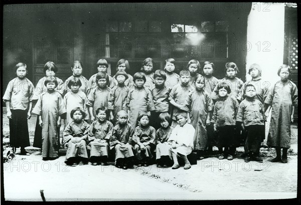 Children freed from 'mui tsai'. Portrait of a group of child slaves, freed from domestic servitude under the customary Chinese 'mui tsai' system. Hong Kong, (People's Republic of China), circa 1930. Hong Kong, Hong Kong, China, People's Republic of, Eastern Asia, Asia.