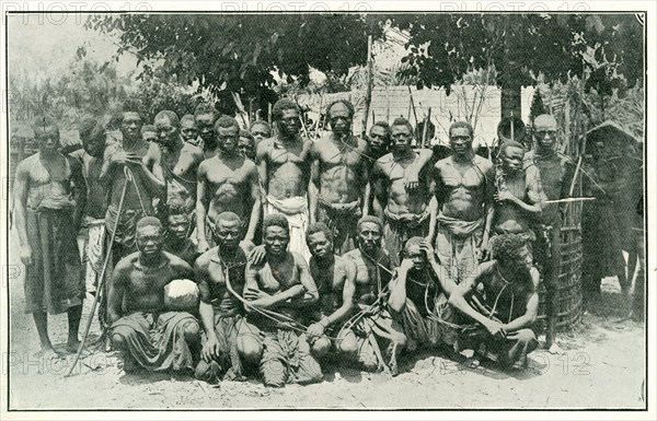 Congolese rubber slaves. Portrait of a group of male slaves, tied together with ropes around their necks and arranged in rows for the camera. The men are rubber workers, enslaved under King Leopold II's terror regime. Kasai, Congo Free State (Democratic Republic of Congo), circa 1904., Kasai, Congo, Democratic Republic of, Central Africa, Africa.