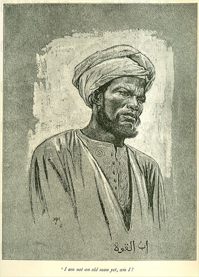 Portrait of a Sudanese slave. Illustration of a Sudanese slave, wearing traditional dress and a turban. A printed caption beneath the image reads: 'I am not an old man yet, am I?'. Sudan, circa 1889. Sudan, Eastern Africa, Africa.