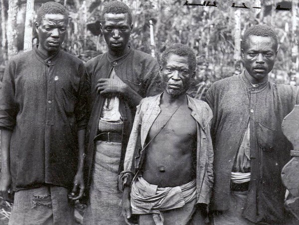 Indentured workers on Sao Tome. Portrait of four Angolan 'slaves', indentured workers employed on the coffee or cocoa plantations of Sao Tome, a Portuguese colony until 1975. Sao Tome, circa 1905. Sao Tome and Principe, Atlantic Ocean, Africa.