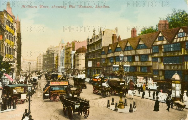 Road junction in Holborn. A busy road junction in Holborn. Pedestrians and horse-drawn carts and coaches crowd the street outside a terrace of half-timbered houses dating from the Tudor period. London, England, circa 1890. London, London, City of, England (United Kingdom), Western Europe, Europe .