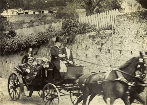 Horse-drawn carriage in Gibraltar. Two distinguished gentlemen are driven along a road by horse-drawn carriage. This is one of several photographs taken during a royal visit to Gibraltar by King Edward VII (1841-1910) and Kaiser Wilhelm II (1859-1941), and may feature the monarchs themselves. Gibraltar, 1904., Gibraltar, Gibraltar, Mediterranean, Europe .