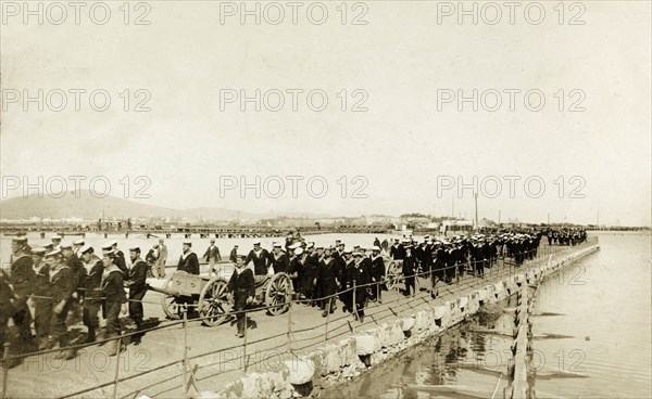 Naval troops at Gibraltar. British naval troops march along a quayside. One of several photographs taken during a royal visit to Gibraltar by King Edward VII (1841-1910) and Kaiser Wilhelm II (1859-1941), the men were probably on their way to or from an official parade held in honour of the visiting monarchs. Gibraltar, 1904., Gibraltar, Gibraltar, Mediterranean, Europe .