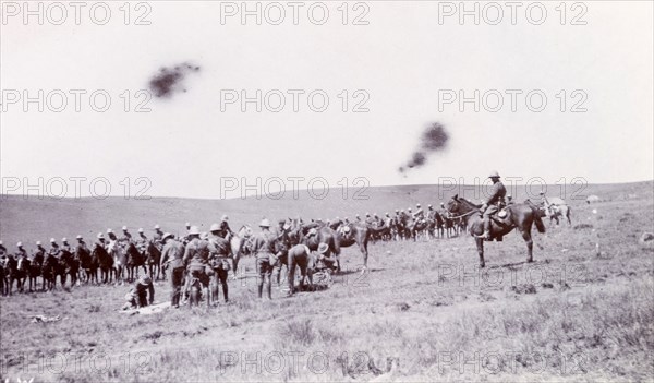 Fallen comrades during the Second Boer War. A mounted British cavalry unit prepares to remove its fallen comrades for burial, killed on one of the many battlefields of the Second Boer War (1899-1902). Probably Natal (KwaZulu Natal), South Africa, circa 1900., KwaZulu Natal, South Africa, Southern Africa, Africa.