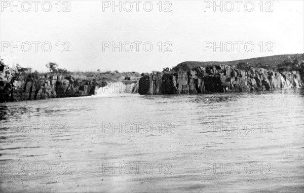 Waterfall at Hlangwani. A small waterfall cascades into the Tugela River near Hlangwani. This photograph was taken shortly after the occupation of Hlangwani, a battle fought between British and Boer troops during the Second Boer War (1899-1902). Natal (KwaZulu Natal), South Africa, circa 1900., KwaZulu Natal, South Africa, Southern Africa, Africa.