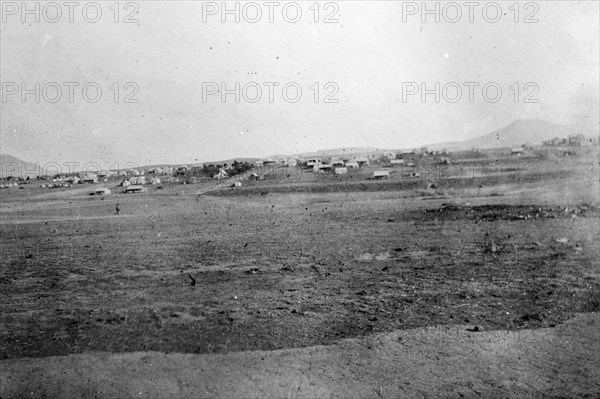 Military camp at Volksrust. Tents line the horizon at a British military camp taken over from the Boers during the Second Boer War (1899-1902). Located beside a railway line, the base also housed a concentration camp for Boer women and children. Volksrust, Transvaal (Mpumalanga), South Africa, circa 1901. Volksrust, Mpumalanga, South Africa, Southern Africa, Africa.
