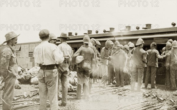 Loading a hospital train at Standerton. Uniformed British troops help to load up a hospital train with rifles and luggage at Standerton, a town garrisoned by the British during the Second Boer War (1899-1902). Standerton, Transvaal (Mpumalanga), South Africa, circa 1901. Standerton, Mpumalanga, South Africa, Southern Africa, Africa.