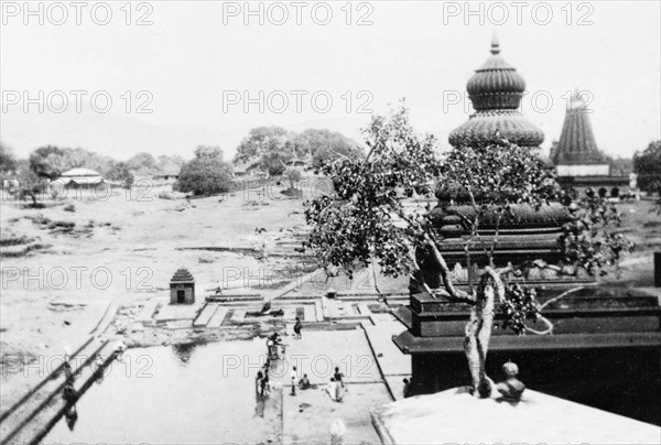 Ornate temples at Wai. Ornate temples tower over courtyards by the banks of the River Krishna. Wai, Maharashtra, India, circa 4 June 1926. Wai, Maharashtra, India, Southern Asia, Asia.