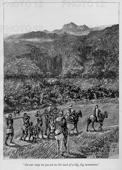 A slave caravan. A book illustration depicts a slave caravan of men, women and children being herded through a mountain pass, tethered in pairs by wooden yokes fixed around their necks. Their captors wear traditional Arab dress and ride on horseback carrying rifles. Sudan, 1889. Sudan, Eastern Africa, Africa.