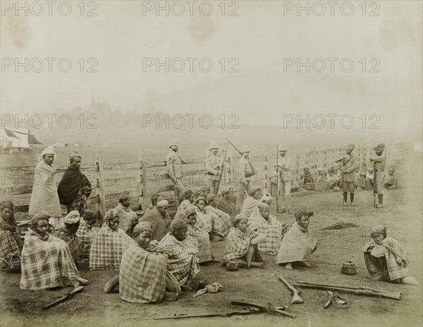 Burmese rebels surrender at Wuntho. Captured Burmese rebels surrender their arms to British forces under a general amnesty. Allied to the Saopha of Wuntho, their opposition to the British annexation of Burma (Mynamar) led to conflict at Wuntho where they subsequently lost control of the area. Wuntho, Burma (Myanmar), 1891. Wuntho, Sagaing, Burma (Myanmar), South East Asia, Asia.