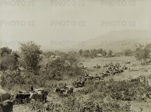 Arrival of Commissariat carts. Bullock-drawn Commissariat carts laden with food and provisions arrive at Wuntho. The supplies were intended for British Army troops who had recently captured the town following a conflict with Burmese rebels. Wuntho, Burma (Myanmar), 1891. Wuntho, Sagaing, Burma (Myanmar), South East Asia, Asia.