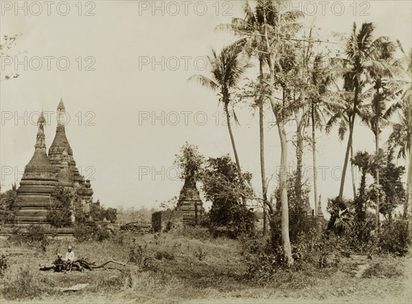 Deserted shrine at Wuntho. Several carved stone 'zeidis' or pagodas emerge from the undergrowth at a deserted shrine. This scene was captured shortly after British forces took control of Wuntho following a conflict with Burmese rebels. Wuntho, Burma (Myanmar), 1891. Wuntho, Sagaing, Burma (Myanmar), South East Asia, Asia.