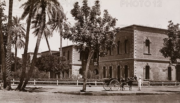 Post Office in Khartoum. Exterior view of the Post Office in Khartoum. A Sudanese man with a horse and cart stands outside in front of the two-storey, colonial-style building. Khartoum, Sudan, circa 1910. Karachi, Sindh, Pakistan, Southern Asia, Asia.