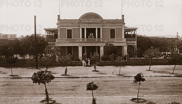 National Bank of Egypt in Khartoum. Exterior view of the facade of the National Bank of Egypt in Khartoum. The two-storey building, built in 1901, features a colonnaded verandah and a walled garden. Khartoum, Sudan, circa 1910. Khartoum, Khartoum, Sudan, Eastern Africa, Africa.