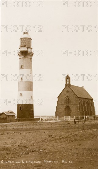 Manora Point lighthouse and St. Paul's Church. View of Manora Point lighthouse and St. Paul's Church, located on Manora Island overlooking Karachi Harbour. Manora Island, India (Pakistan), circa 1910. Manora Island, Sindh, Pakistan, Southern Asia, Asia.