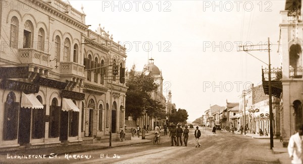 Elphinstone Street in Karachi. View down Elphinstone Street in Karachi. One of Karachi's oldest streets, it was named in honour of a British colonist and is lined with colonial-style buildings. It was renamed Zaibunnisa Street in 1970 by the Karachi Government in honour of Pakastani journalist, Zaib-un-Nissa Hamidullah. Karachi, India (Pakistan), circa 1910. Karachi, Sindh, Pakistan, Southern Asia, Asia.