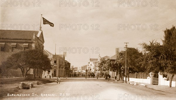 Elphinstone Street in Karachi. View down Elphinstone Street in Karachi. One of Karachi's oldest streets, it was named in honour of a British colonist and is lined with colonial-style buildings. It was renamed Zaibunnisa Street in 1970 by the Karachi Government in honour of Pakastani journalist, Zaib-un-Nissa Hamidullah. Karachi, India (Pakistan), circa 1910. Karachi, Sindh, Pakistan, Southern Asia, Asia.